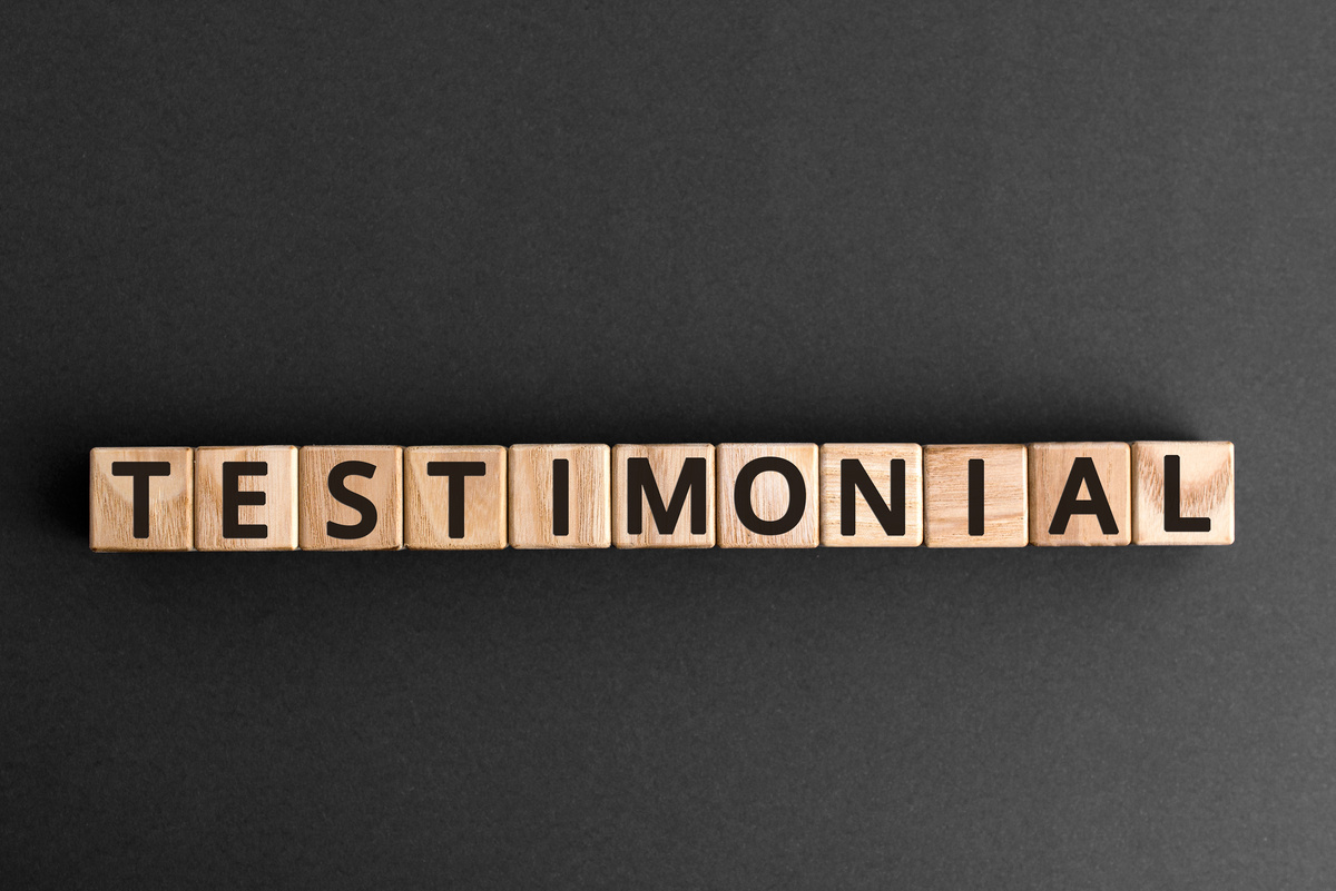 Testimonial - word from wooden blocks with letters